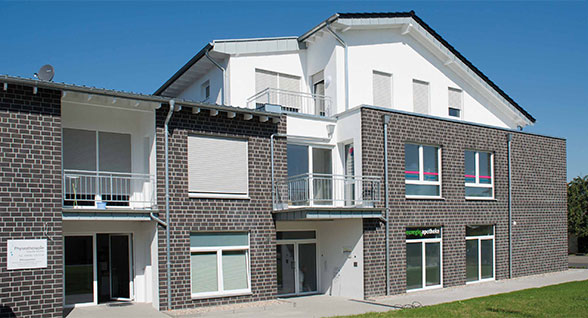 Wohn- Geschäftsgebäude Kirchhoven